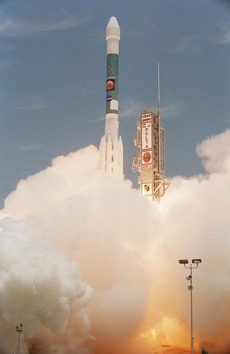 KENNEDY SPACE CENTER, FLA. -    With smoke and steam billowing beneath, the Delta II rocket with its Mars Exploration Rover (MER-A) payload leaps off the launch pad into the blue sky to begin its journey to Mars.  Liftoff occurred on time at 1:58 p.m. EDT from Launch Complex 17-A, Cape Canaveral Air