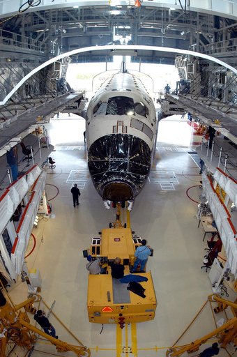 KENNEDY SPACE CENTER, FLA. -- Endeavour begins rolling out of the Orbiter Processing Facility for temporary transfer to the Vehicle Assembly Building. The move allows work to be performed in the OPF that can only be accomplished while the bay is empty. Work scheduled in the OPF includes annual valid