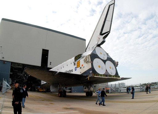 KENNEDY SPACE CENTER, FLA. -- Endeavour backs out of the Orbiter Processing Facility for temporary transfer to the Vehicle Assembly Building. The move allows work to be performed in the OPF that can only be accomplished while the bay is empty. Work scheduled in the OPF includes annual validation of 