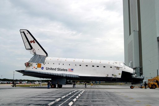 KENNEDY SPACE CENTER, FLA. -- Endeavour is towed in front of the Vehicle Assembly Building (VAB) where it is going for temporary storage.  The orbiter has been moved from the Orbiter Processing Facility (OPF) to allow work to be performed in the OPF that can only be accomplished while the bay is emp