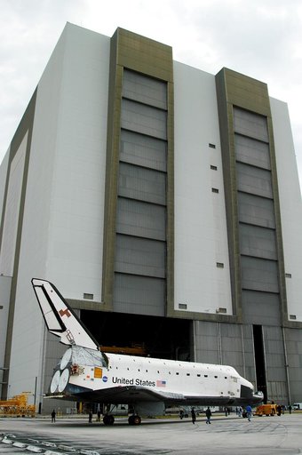 KENNEDY SPACE CENTER, FLA. -- Endeavour is towed in front of the Vehicle Assembly Building (VAB) where it is going for temporary storage.  The orbiter has been moved from the Orbiter Processing Facility (OPF) to allow work to be performed in the OPF that can only be accomplished while the bay is emp