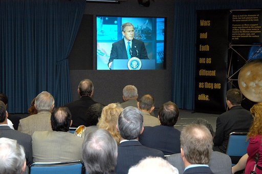 KENNEDY SPACE CENTER, FLA. -- KSC management and other employees gather in the Center’s television studio to watch the address by President George W. Bush at NASA Headquarters in Washington, D.C., stating his goals for NASA’s new mission:  Completing the International Space Station, retiring the Spa