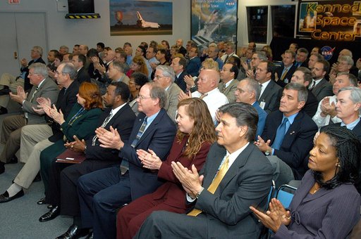 KENNEDY SPACE CENTER, FLA. -- In the KSC television studio, KSC management and other employees applaud President George W. Bush, who addressed the public and an assembly of government officials at NASA Headquarters as he outlined a new focus and vision for the space agency.  Seated in the front row,