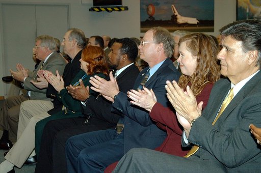 KENNEDY SPACE CENTER, FLA. -- In the KSC television studio, KSC management and other employees applaud President George W. Bush, who addressed the public and an assembly of government officials at NASA Headquarters as he outlined a new focus and vision for the space agency.  Seated in the front row,