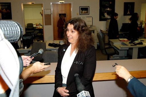 KENNEDY SPACE CENTER, FLA. -- Maria Littlefield, chief technologist with the Launch Services Program Office, talks to the media at the NASA-KSC News Center after viewing President George W. Bush’s message on the future of NASA.  The President stated his goals for NASA’s new mission: Completing the I