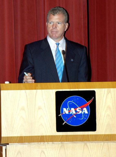 KENNEDY SPACE CENTER, FLA. -- U.S. Rep. Tom Feeney addresses employees in a Town Hall meeting at KSC with comments on the new mission for NASA outlined by President George W. Bush Jan. 14.  He shared the stage with U.S. Rep. Dave Weldon and Center Director Jim Kennedy. All three later answered quest