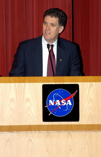 KENNEDY SPACE CENTER, FLA. -- U.S. Rep. Dave Weldon addresses employees in a Town Hall meeting at KSC with comments on the new mission for NASA outlined by President George W. Bush Jan. 14.  He shared the stage with U.S. Rep. Tom Feeney and Center Director Jim Kennedy.  All three later answered ques