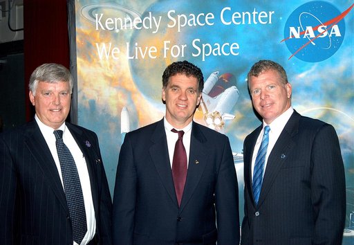 KENNEDY SPACE CENTER, FLA. --After a Town Hall meeting at KSC, Center Director Jim Kennedy and U.S. Reps. Dave Weldon and Tom Feeney pause for a photo before heading to the NASA-KSC News Center for a press conference.  Weldon and Feeney discussed the new mission for NASA outlined by President George