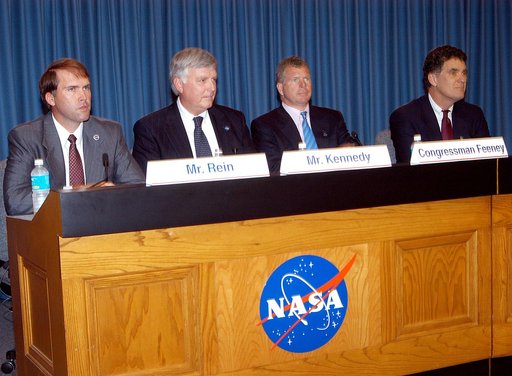 KENNEDY SPACE CENTER, FLA. -- Mike Rein (at left), division chief of KSC External Affairs, moderates the press conference featuring (second from left to right) U.S. Rep. Tom Feeney, Center Director Jim Kennedy and U.S. Rep. Dave Weldon.  The media were interested in hearing Kennedy’s and the congres