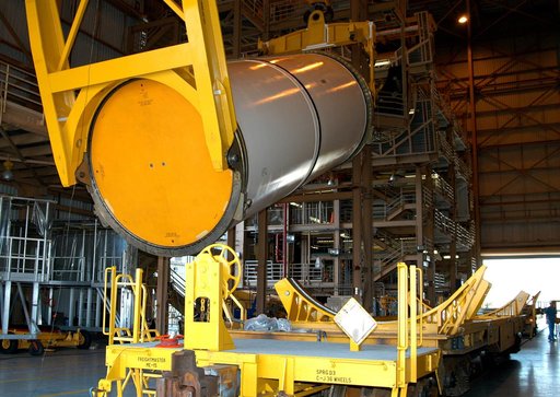 KENNEDY SPACE CENTER, FLA. -  In the Rotation Processing and Surge Facility, an SRB solid segment is being rotated to horizontal for placement on a rail car.  The segment is being shipped to Utah for testing.  The segment was part of the STS-114 stack.  It is the first time actual flight segments th