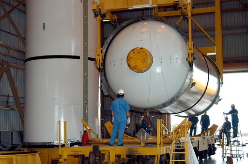 KENNEDY SPACE CENTER, FLA. -  In the Rotation Processing and Surge Facility, an SRB solid segment is lowered onto a rail car for shipment to Utah where it will be tested.  The segment was part of the STS-114 stack.  It is the first time actual flight segments that had been stacked for flight in the 