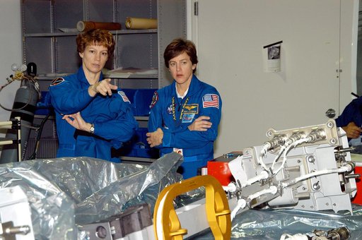 KENNEDY SPACE CENTER, FLA. -  STS-114 Commander Eileen Collins and Mission Specialist Wendy Lawrence look over mission equipment in the Space Station Processing Facility.  Crew members are at KSC for equipment familiarization.  STS-114 is classified as Logistics Flight 1 to the International Space S