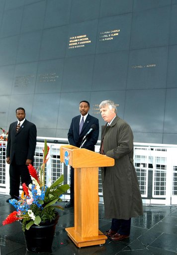 KENNEDY SPACE CENTER, FLA. -  Center Director Jim Kennedy (right) speaks to attendees at a memorial service honoring the crew of Columbia.  At left are KSC Deputy Director Woodrow Whitlow Jr. and Executive Director of Florida Space Authority Winston Scott, who was an invited speaker.  Scott is a for