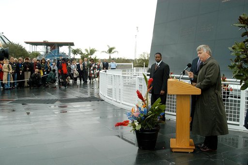 KENNEDY SPACE CENTER, FLA. -  Center Director Jim Kennedy (right) speaks to attendees at a memorial service honoring the crew of Columbia.  Behind him are KSC Deputy Director Woodrow Whitlow Jr. and Executive Director of Florida Space Authority Winston Scott, who is a former astronaut who flew on Co