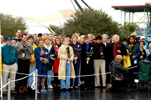 KENNEDY SPACE CENTER, FLA. -  Friends, co-workers and families gather at the Space Memorial Mirror for KSC’s special service remembering and honoring the crew of Columbia.  Feb. 1 is the one-year anniversary of the loss of the crew and orbiter Columbia in a tragic accident as the ship returned to Ea
