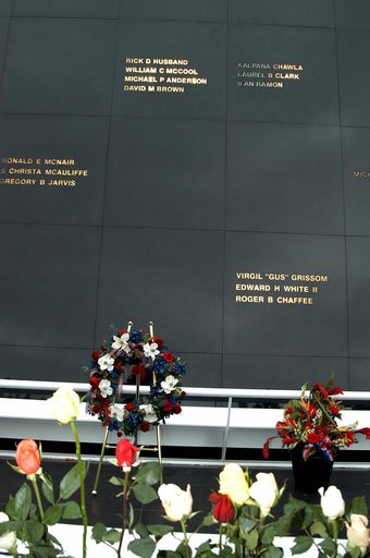 KENNEDY SPACE CENTER, FLA. -  Roses and a floral wreath adorn the Space Memorial Mirror following a memorial service for the crew of Columbia.  Feb. 1 is the one-year anniversary of the loss of the crew and orbiter Columbia in a tragic accident as the ship returned to Earth following mission STS-107
