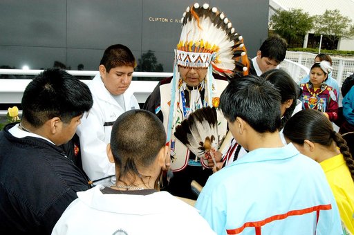 KENNEDY SPACE CENTER, FLA. - Dancers from the Shoshone-Bannock Junior-Senior High School, Fort Hall, Idaho, perform a healing ceremony during the memorial service held at the Space Memorial Mirror for the crew of Columbia.  Feb. 1 is the one-year anniversary of the loss of the crew and orbiter Colum