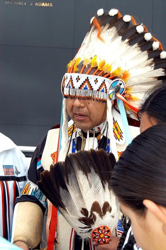 KENNEDY SPACE CENTER, FLA. - Dancers from the Shoshone-Bannock Junior-Senior High School, Fort Hall, Idaho, perform a healing ceremony during the memorial service held at the Space Memorial Mirror for the crew of Columbia.  Feb. 1 is the one-year anniversary of the loss of the crew and orbiter Colum
