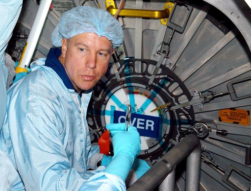 KENNEDY SPACE CENTER, FLA. - Astronaut Tim Kopra aids in Intravehicular Activity (IVA) constraints testing on the Italian-built Node 2, a future element of the International Space Station.  The second of three Station connecting modules, the Node 2 attaches to the end of the U.S. Lab and provides at