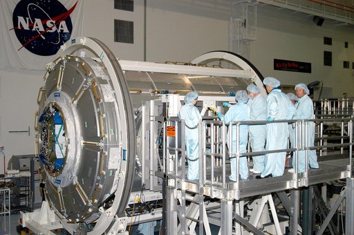 KENNEDY SPACE CENTER, FLA. - In the Space Station Processing Facility, workers check over the Italian-built Node 2, a future element of the International Space Station.  The second of three Station connecting modules, the Node 2 attaches to the end of the U.S. Lab and provides attach locations for s