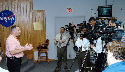 KENNEDY SPACE CENTER, FLA. - Armando Oliu, Final Inspection Team lead for the Shuttle program, speaks to reporters about the aid the Image Analysis Lab is giving the FBI in a kidnapping case.  Oliu oversees the image lab that is using an advanced SGI® TP9500 data management system to review the tape