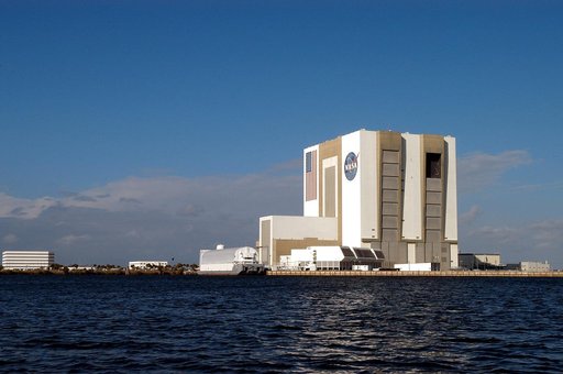 KENNEDY SPACE CENTER, FLA. - From a boat on the Banana River the Vehicle Assembly Building looms over the water.  The boat holds Karen Holloway-Adkins, KSC wildlife specialist, who is studying the life history of sea turtles, especially what they eat, where they lay their eggs and what factors might