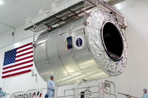 KENNEDY SPACE CENTER, FLA. - The Multi-Purpose Logistics Module Raffaello is lifted from its stand in the Space Station Processing Facility to move to another work stand.  Raffaello is the second MPLM built by the Italian Space Agency, serving as a reusable logistics carrier and primary delivery sys