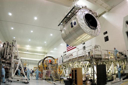 KENNEDY SPACE CENTER, FLA. - The Multi-Purpose Logistics Module Raffaello moves away from its stand in the Space Station Processing Facility.  Raffaello is the second MPLM built by the Italian Space Agency, serving as a reusable logistics carrier and primary delivery system to resupply and return st