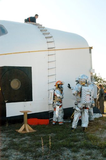 KENNEDY SPACE CENTER, FLA. - Emergency crew members prepare to rescue another “astronaut” from inside the orbiter crew compartment mock-up that is the scene of a “Mode VII” emergency landing simulation at Kennedy Space Center.  The purpose of the Mode VII is to exercise emergency preparedness person