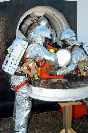 KENNEDY SPACE CENTER, FLA. - Emergency crew members “rescue” an injured astronaut from the orbiter crew compartment mock-up during a “Mode VII” emergency landing simulation at Kennedy Space Center.  The purpose of the Mode VII is to exercise emergency preparedness personnel, equipment and facilities