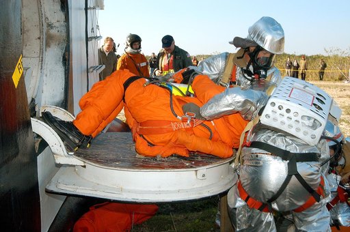 KENNEDY SPACE CENTER, FLA. - Emergency crew members “rescue” an injured astronaut from the orbiter crew compartment mock-up during a “Mode VII” emergency landing simulation at Kennedy Space Center.  The purpose of the Mode VII is to exercise emergency preparedness personnel, equipment and facilities