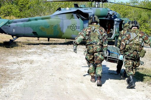 KENNEDY SPACE CENTER, FLA. - A rescue team carries an “injured” astronaut toward the helicopter for transportation to a local hospital.  They are all taking part in a “Mode VII” emergency landing simulation at Kennedy Space Center.  The purpose of the Mode VII is to exercise emergency preparedness p