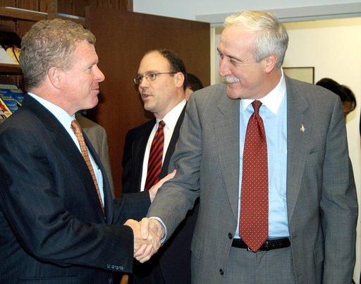 KENNEDY SPACE CENTER, FLA. - NASA Administrator Sean O’Keefe (right) greets Florida Congressman Tom Feeney during a tour of the Central Florida Research Park, near Orlando.  Central Florida leaders are proposing the research park as the site for the new NASA Shared Services Center.  The center would