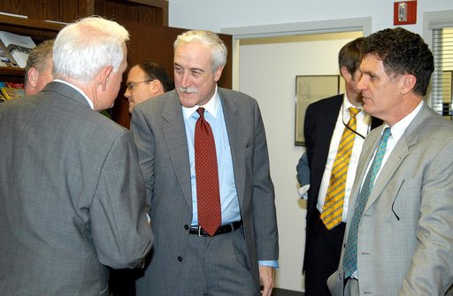 KENNEDY SPACE CENTER, FLA. - NASA Administrator Sean O’Keefe  (center) is welcomed to the Central Florida Research Park, near Orlando.  Central Florida leaders are proposing the research park as the site for the new NASA Shared Services Center.  The center would centralize NASA’s payroll, accounting
