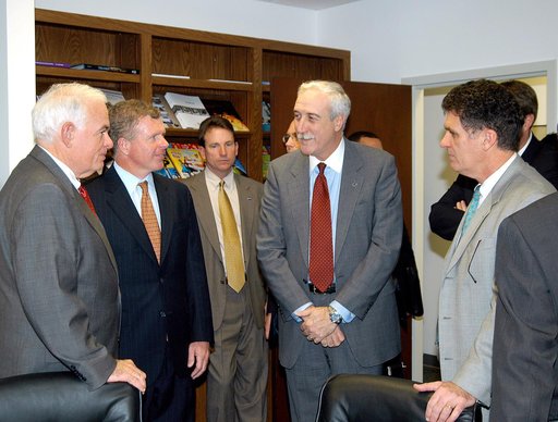 KENNEDY SPACE CENTER, FLA. - NASA Administrator Sean O’Keefe (center) listens to Congressman Tom Feeney (second from left) during a tour of the Central Florida Research Park, near Orlando.  At right is U.S. Congressman Dave Weldon.  Central Florida leaders are proposing the research park as the site