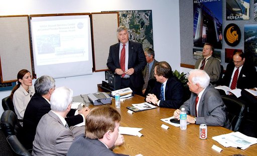 KENNEDY SPACE CENTER, FLA. - KSC Director Jim Kennedy makes a presentation to NASA and other officials about the benefits of locating NASA’s new Shared Services Center in the Central Florida Research Park, near Orlando.  At the far left is Pamella J. Dana, Ph.D., director, Office of Tourism, Trade, 