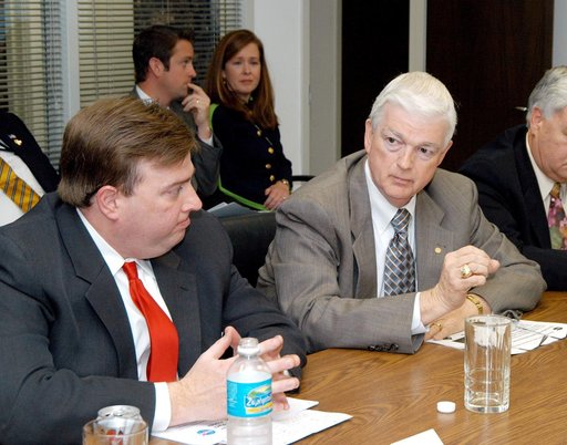 KENNEDY SPACE CENTER, FLA. - - U.S. Representative Ric Keller (left) listens intently to a presentation proposing the use of the Central Florida Research Park, near Orlando, as the site of NASA’s new Shared Services Center.  NASA and Florida officials toured the research park as well.  Central Flori