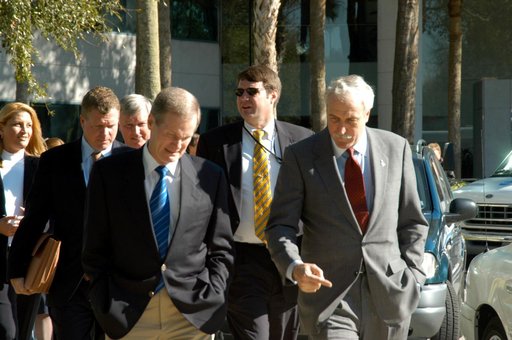 KENNEDY SPACE CENTER, FLA. - U.S. Senator Bill Nelson (left foreground) and NASA Administrator Sean O’Keefe (right) look deep in conversation as they leave the Central Florida Research Park, near Orlando.  Behind Nelson is Congressman Tom Feeney and Center Director Jim Kennedy.  The research park is