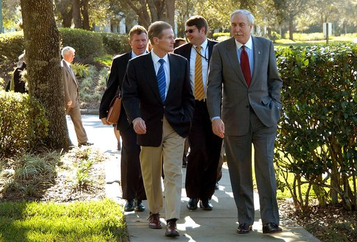 KENNEDY SPACE CENTER, FLA. - U.S. Senator Bill Nelson (left front) and NASA Administrator Sean O’Keefe (right front) leave the Central Florida Research Park, near Orlando.  Behind Nelson (at left) is Congressman Tom Feeney.  The research park is being proposed as the location for NASA’s new Shared S