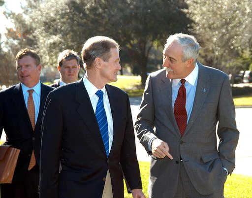 KENNEDY SPACE CENTER, FLA. - U.S. Senator Bill Nelson (center) and NASA Administrator Sean O’Keefe are deep in conversation as they leave the Central Florida Research Park, near Orlando.  Behind Nelson at left is Congressman Tom Feeney.  The research park is being proposed as the location for NASA’s