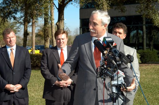 KENNEDY SPACE CENTER, FLA. - NASA Administrator Sean O’Keefe talks to the media at the Central Florida Research Park, near Orlando.  He and government officials were at the park for a presentation about the assets of the research park as the site of NASA’s new Shared Services Center. Behind O’Keefe 
