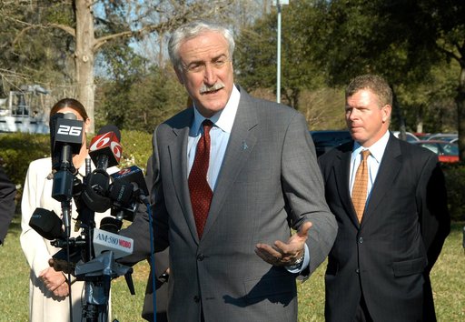 KENNEDY SPACE CENTER, FLA. - NASA Administrator Sean O’Keefe talks to the media at the Central Florida Research Park, near Orlando.  He and government officials were at the park for a presentation about the assets of the research park as the site of NASA’s new Shared Services Center. Behind O’Keefe 