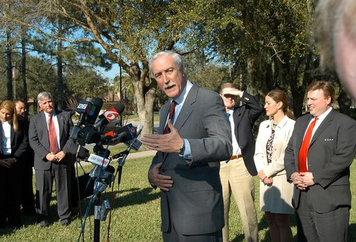KENNEDY SPACE CENTER, FLA. - NASA Administrator Sean O’Keefe talks to the media at the Central Florida Research Park, near Orlando.  He and government officials were at the park for a presentation about the assets of the research park as the site of NASA’s new Shared Services Center. On the left is 