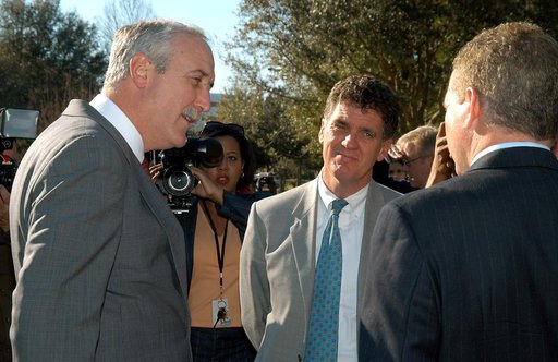 KENNEDY SPACE CENTER, FLA. - After talking to the media, NASA Administrator Sean O’Keefe (left) speaks to Congressman Dave Weldon (center) and Florida Congressman Tom Feeney (right).  O’Keefe and government officials were at the park for a presentation about the assets of the research park as the si