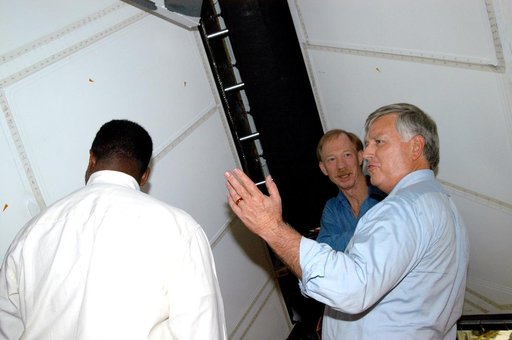 KENNEDY SPACE CENTER, FLA. - On a tour of the Orbiter Processing Facility, Center Director Jim Kennedy (right) and Deputy Director Woodrow Whitlow Jr. (center) look at the rudder speed brake panels on the orbiter Endeavour.  In the background is Tom Roberts, who is with United Space Alliance.  Endea