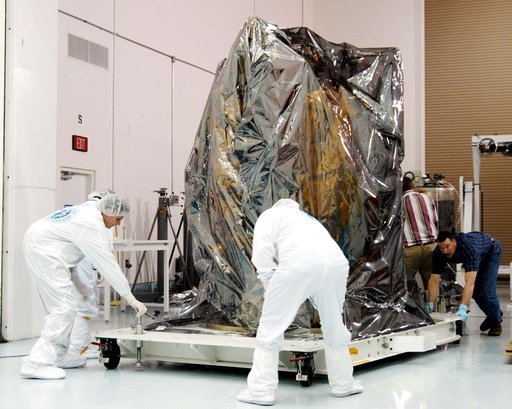 KENNEDY SPACE CENTER, FLA. -  At the Astrotech Space Operations processing facilities near KSC, workers move NASA’s MESSENGER spacecraft into a high bay clean room.  Employees of the Johns Hopkins University Applied Physics Laboratory, builders of the spacecraft, will perform an initial state-of-hea