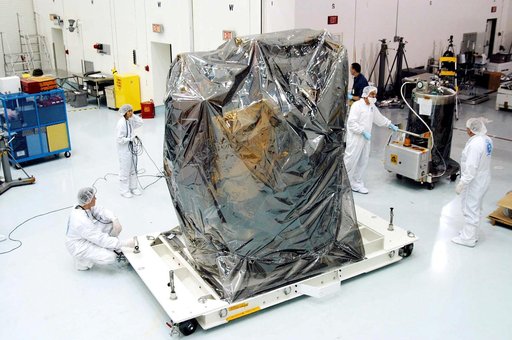 KENNEDY SPACE CENTER, FLA. -  In the high bay clean room at the Astrotech Space Operations processing facilities near KSC, workers get ready to remove the protective cover from NASA’s MESSENGER spacecraft.  Employees of the Johns Hopkins University Applied Physics Laboratory, builders of the spacecr
