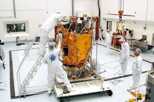 KENNEDY SPACE CENTER, FLA. -  In the high bay clean room at the Astrotech Space Operations processing facilities near KSC, workers prepare to attach an overhead crane to NASA’s MESSENGER spacecraft.  The spacecraft will be moved to a work stand where employees of the Johns Hopkins University Applied