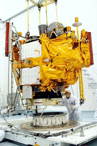 KENNEDY SPACE CENTER, FLA. -  At the Astrotech Space Operations processing facilities, NASA’s MESSENGER spacecraft is lifted off the pallet for transfer to a work stand. There employees of the Johns Hopkins University Applied Physics Laboratory, builders of the spacecraft, will perform an initial st