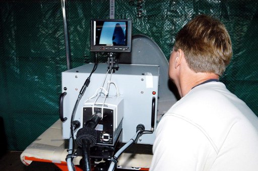 KENNEDY SPACE CENTER, FLA. -  Jim Landy, NDE specialist with United Space Alliance (USA), prepares equipment to examine a Reinforced Carbon Carbon panel using flash thermography.  A relatively new procedure at KSC, thermography uses high intensity light to heat areas of the panels. The panels are th